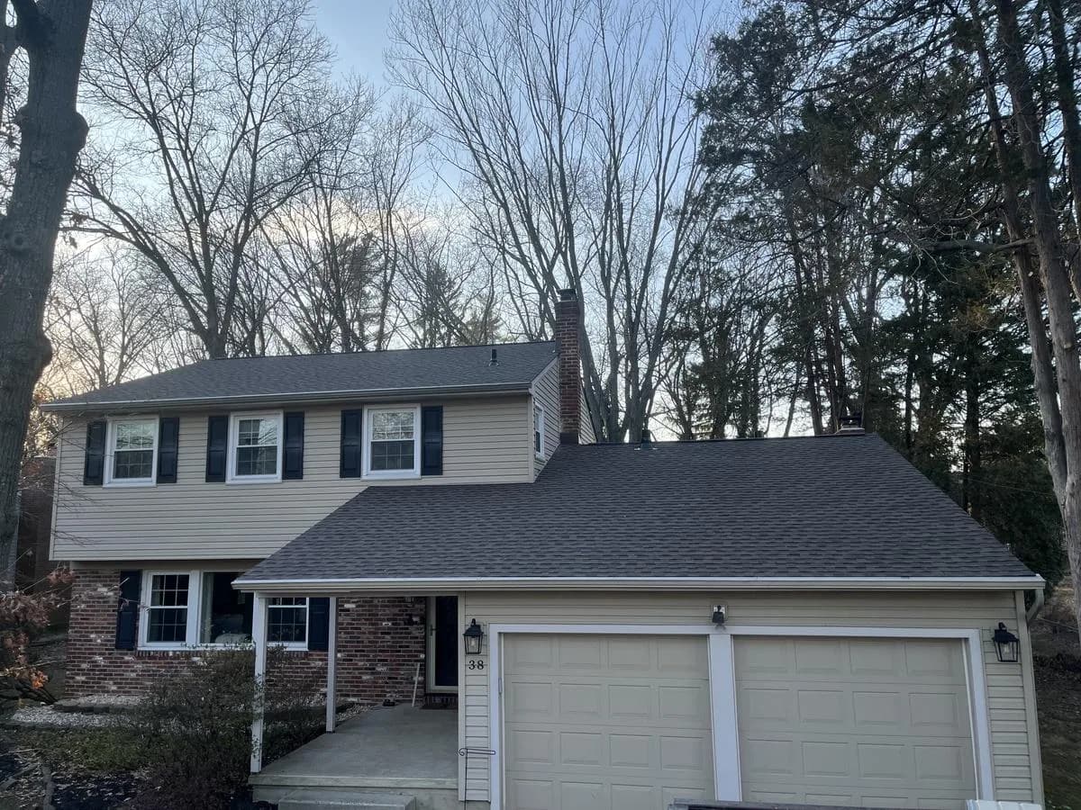 Two-story colonial front elevation with new GAF Timberline HDZ Barkwood roof — Cherry Hill Township