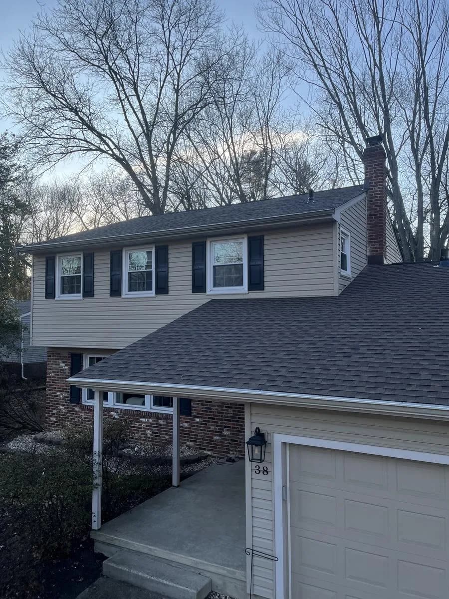 Front-of-home angle with completed Barkwood roof and brick masonry — Cherry Hill Township