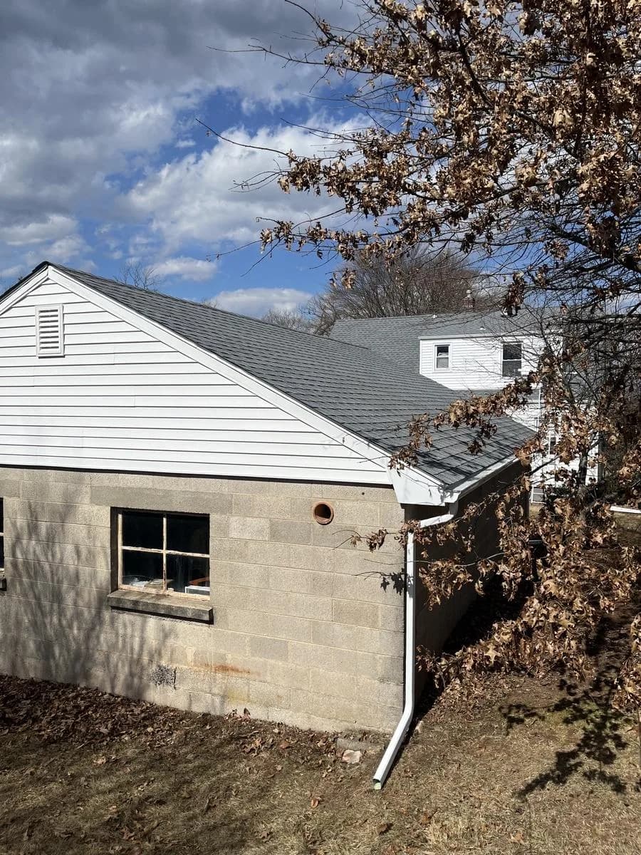 Side dormer with new shingles and upgraded 6-inch white gutter — Hillsborough Township