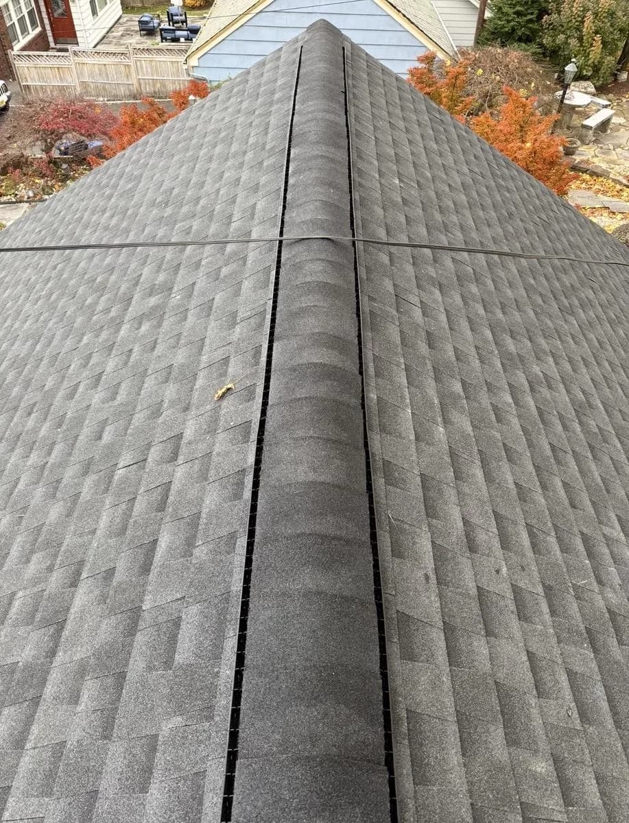 Long ridge view of new Charcoal shingled roof — Montclair