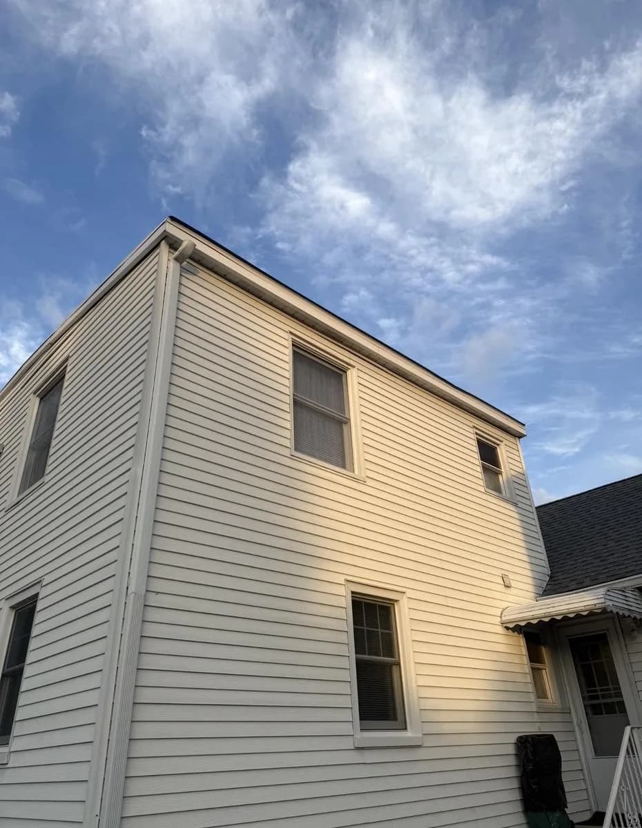 Side elevation showing new flat roof line and Pewter Gray shingles — Nutley