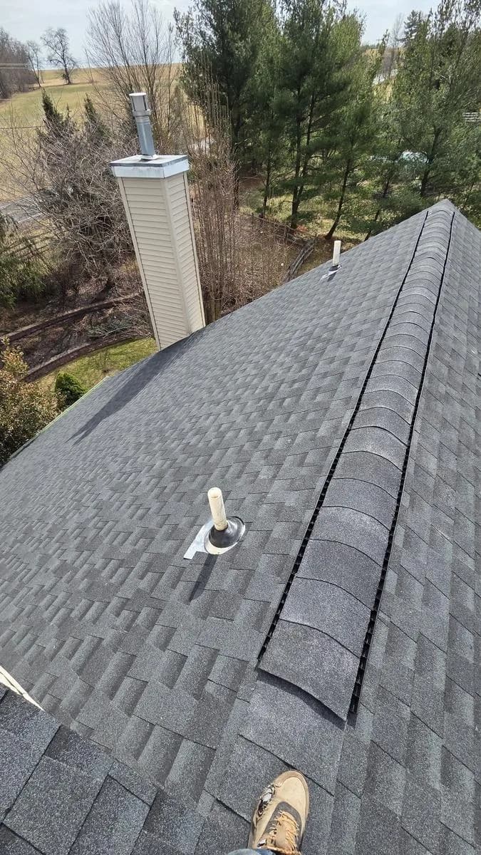 GAF Timberline HDZ Charcoal shingles with ridge cap detail and chimney — Raritan Township roof replacement