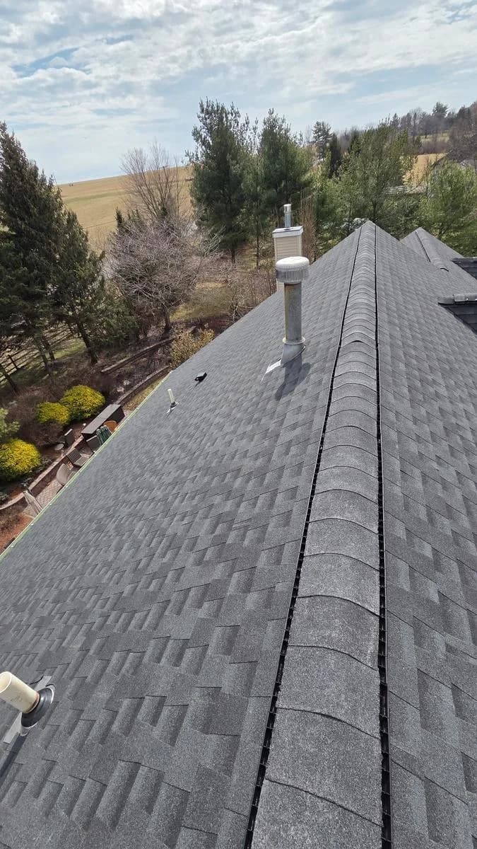 Standing seam 32-gauge aluminum black metal roof installed on bay window — Raritan Township