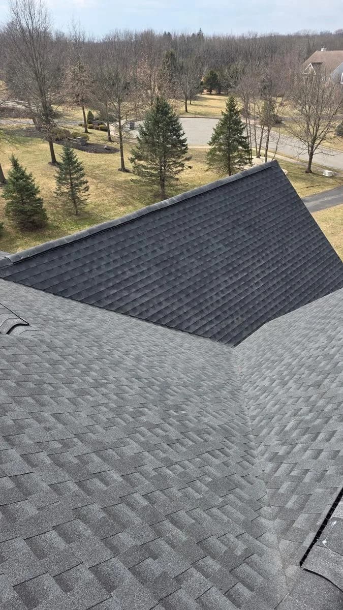 Multi-pitch hip roof completed in GAF Timberline HDZ Charcoal — Raritan Township