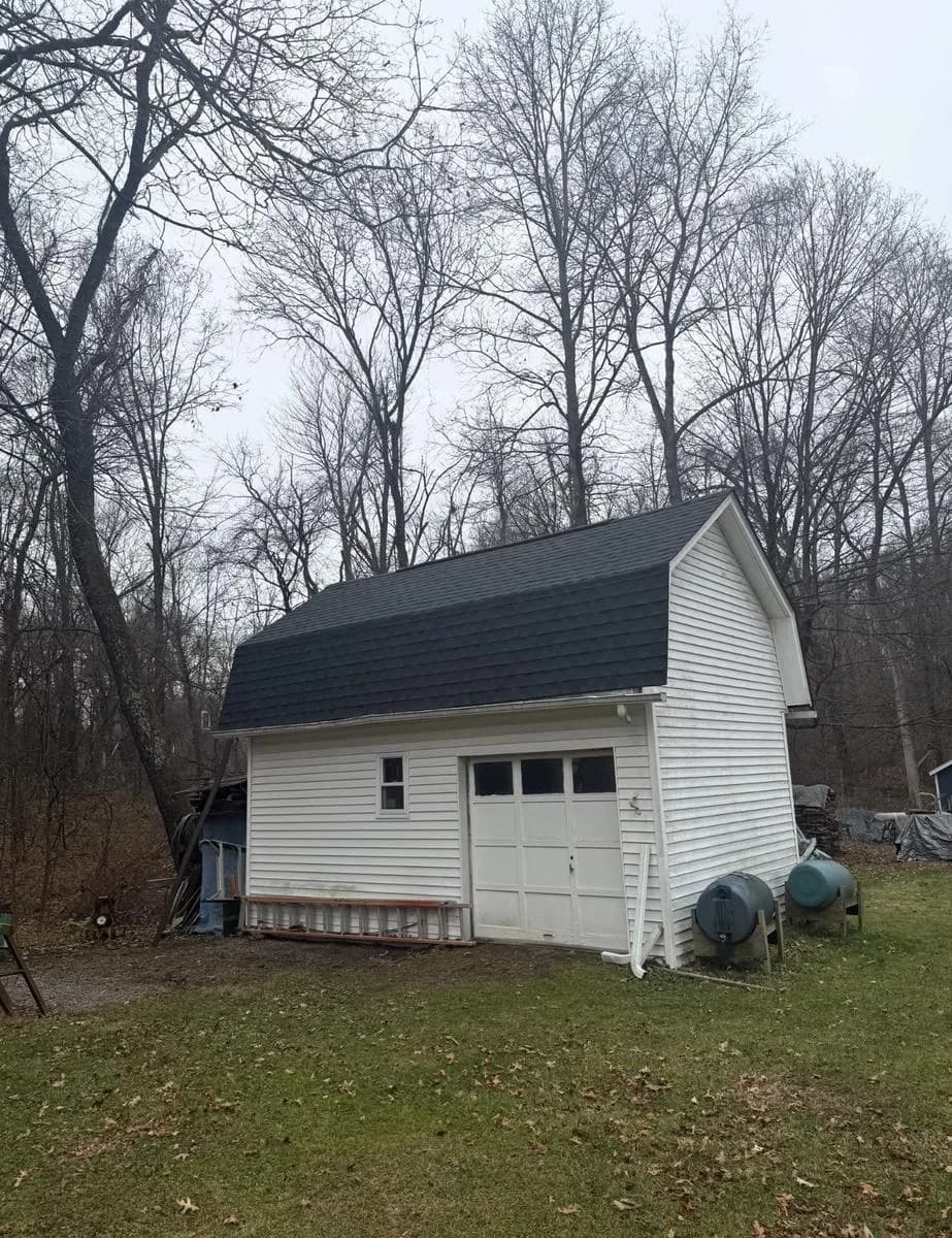 Detached shed with new mansard-style roof in GAF Timberline HDZ Charcoal — Wallkill, NY