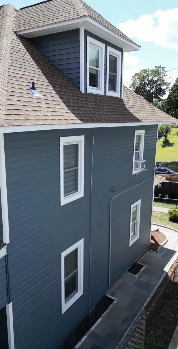 Drone view of dormer and Pacific Blue siding side wall — New Rochelle exterior renovation