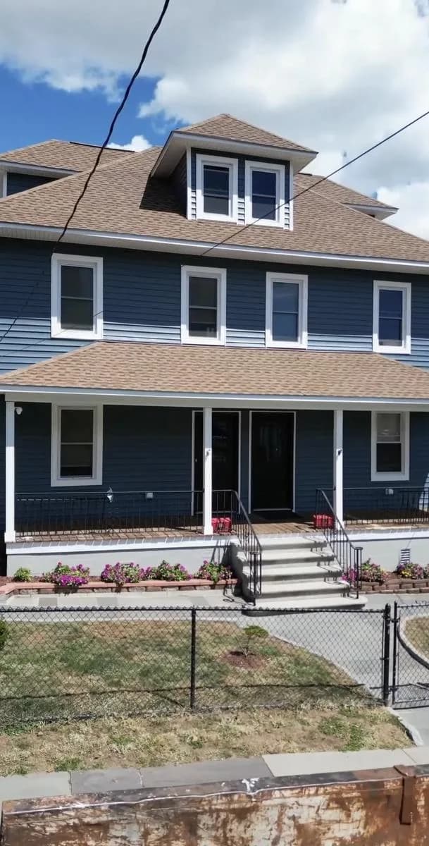 Side facade with new Pacific Blue siding and porch — New Rochelle
