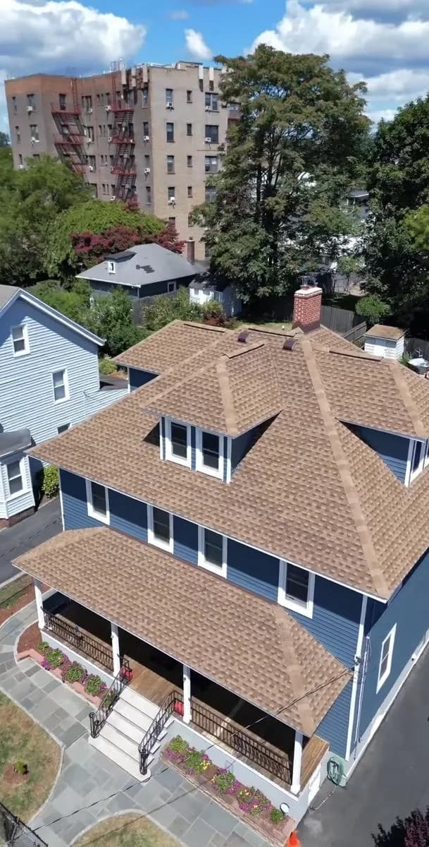 Drone aerial of completed roof and chimney rebuild — New Rochelle