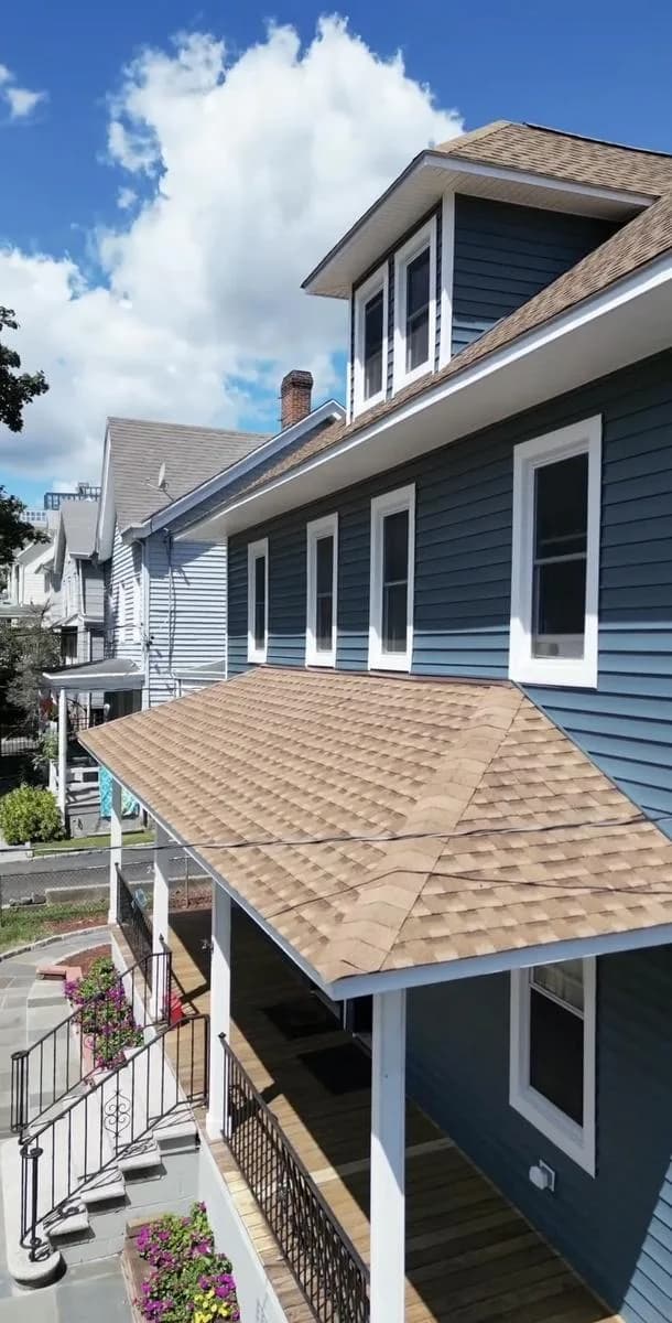 Side view showing porch roof and Pacific Blue dormer — New Rochelle