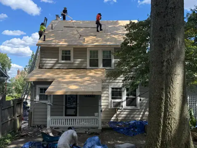 Beautiful wooded home requiring specialized roofing maintenance