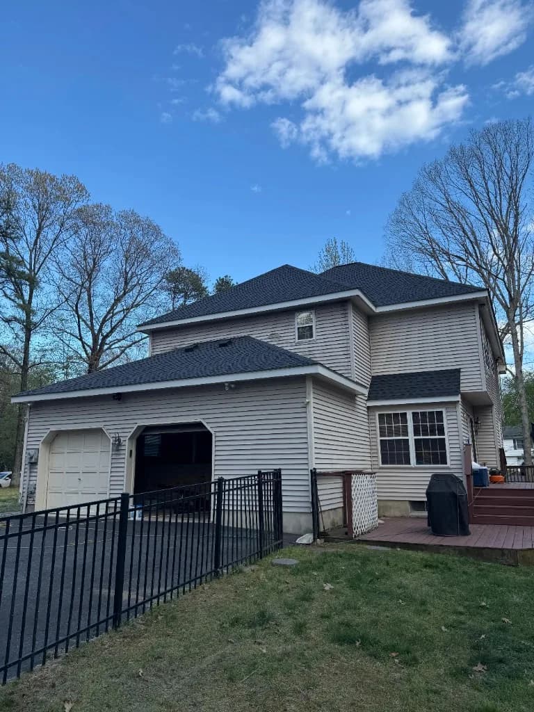 New charcoal shingle roof on two-story home — NJ